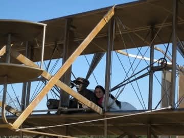 Nikki aboard a Wright Flyer replica.
