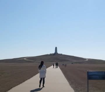 Nikki walking the path up Kill Devil Hill toward the Wright Brothers Memorial.