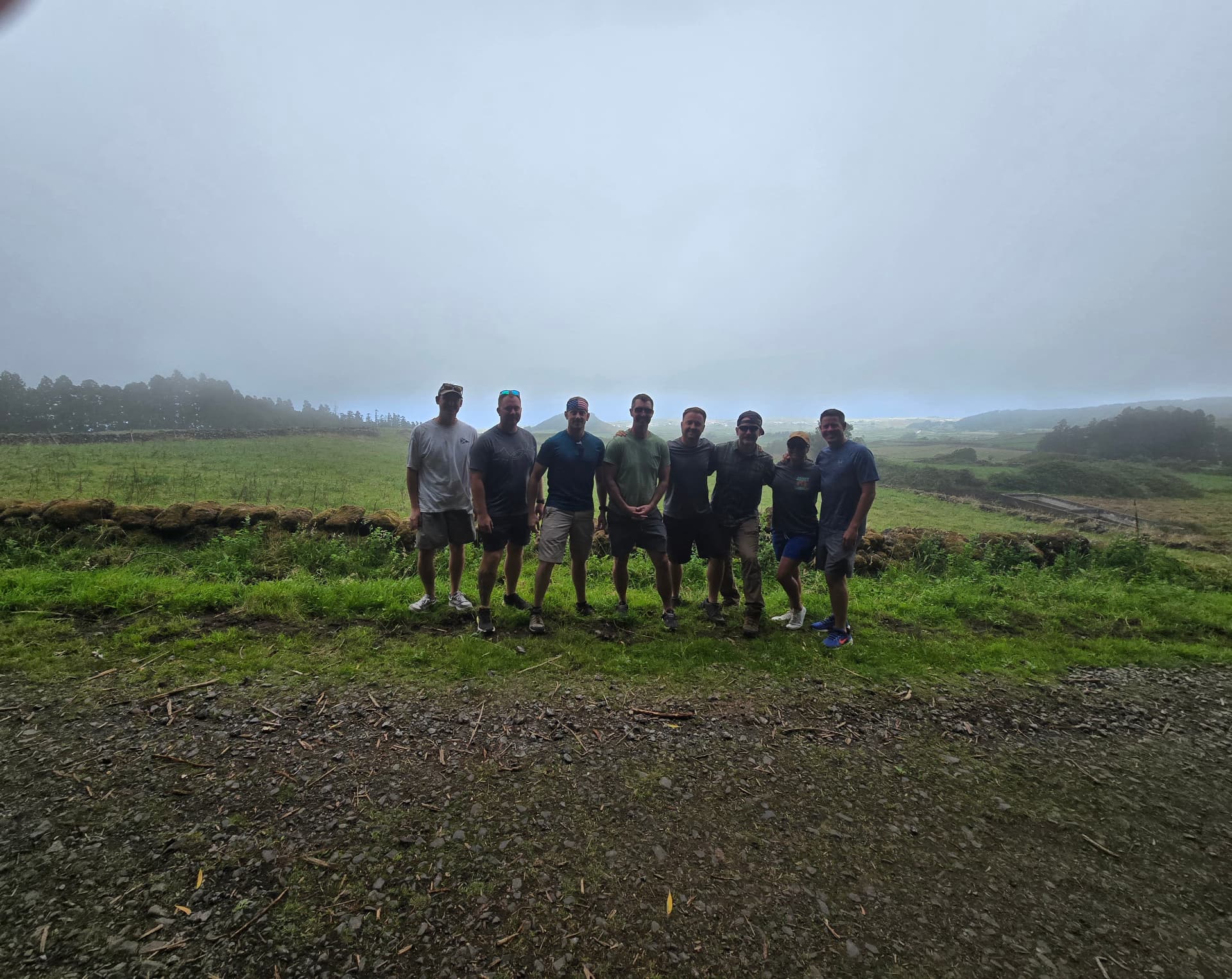 Friends of Nikki and Q standing together in the mist.