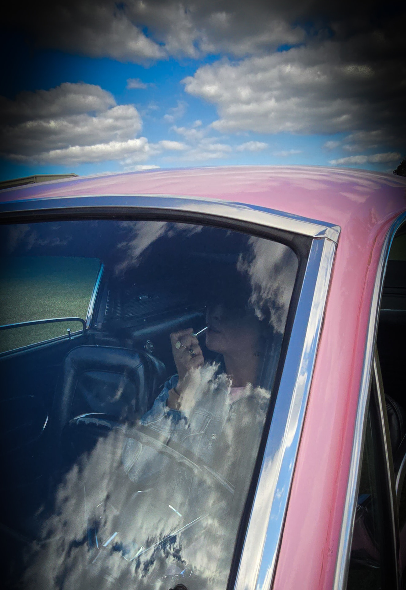Nikki Bodie reflected in Reba Lou's window.