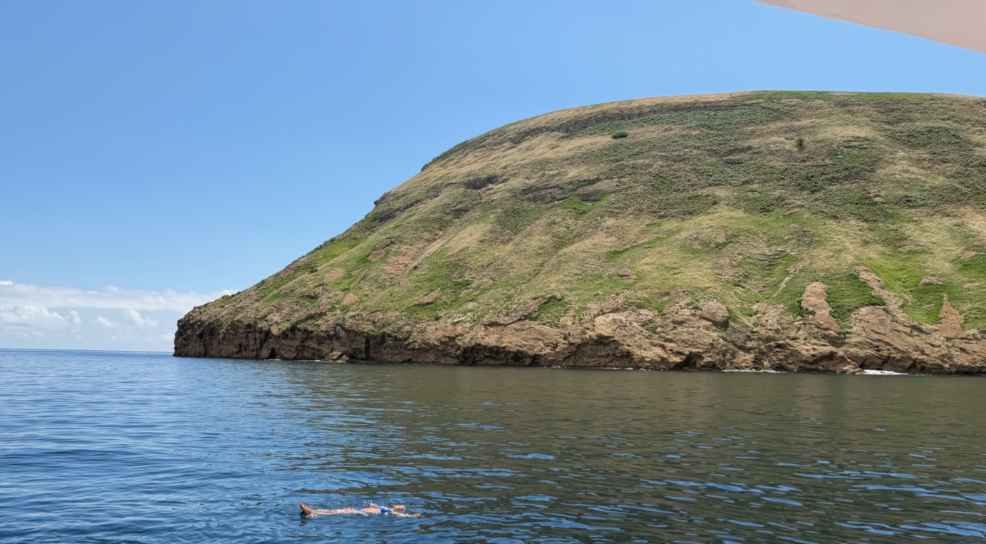 Nikki floating in the Atlantic beside the Goat Islets.