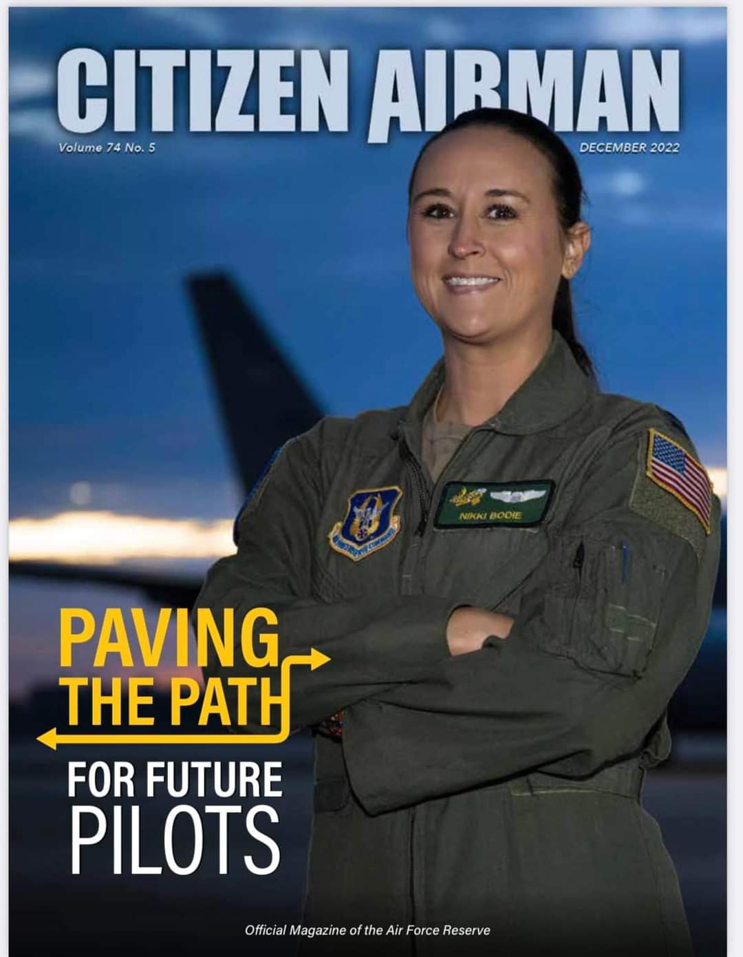 The December 2022 Citizen Airman cover: Nikki, arms crossed, "Paving the Path for Future Pilots."