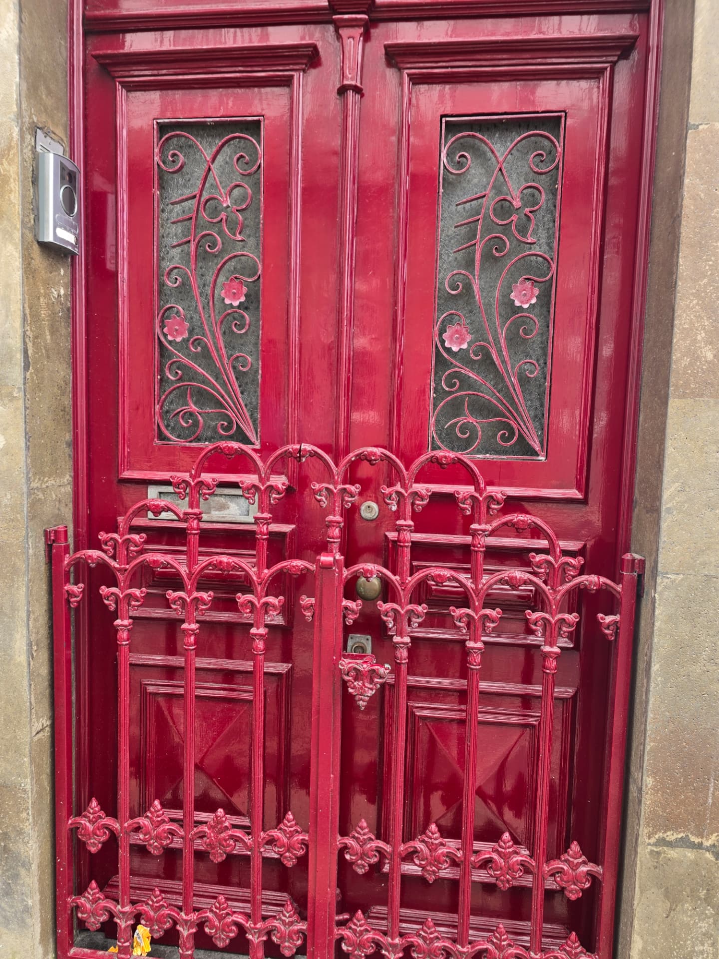 An ornate red double door in Angra.