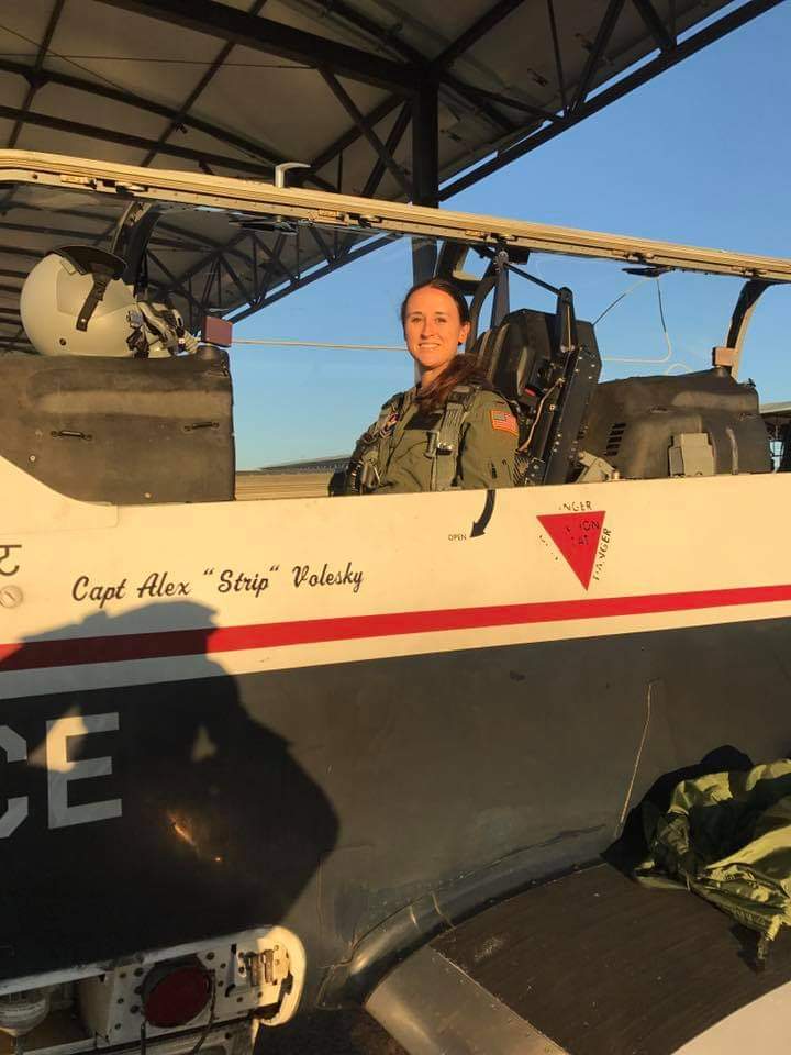 Nikki smiling in the cockpit of a T-6.