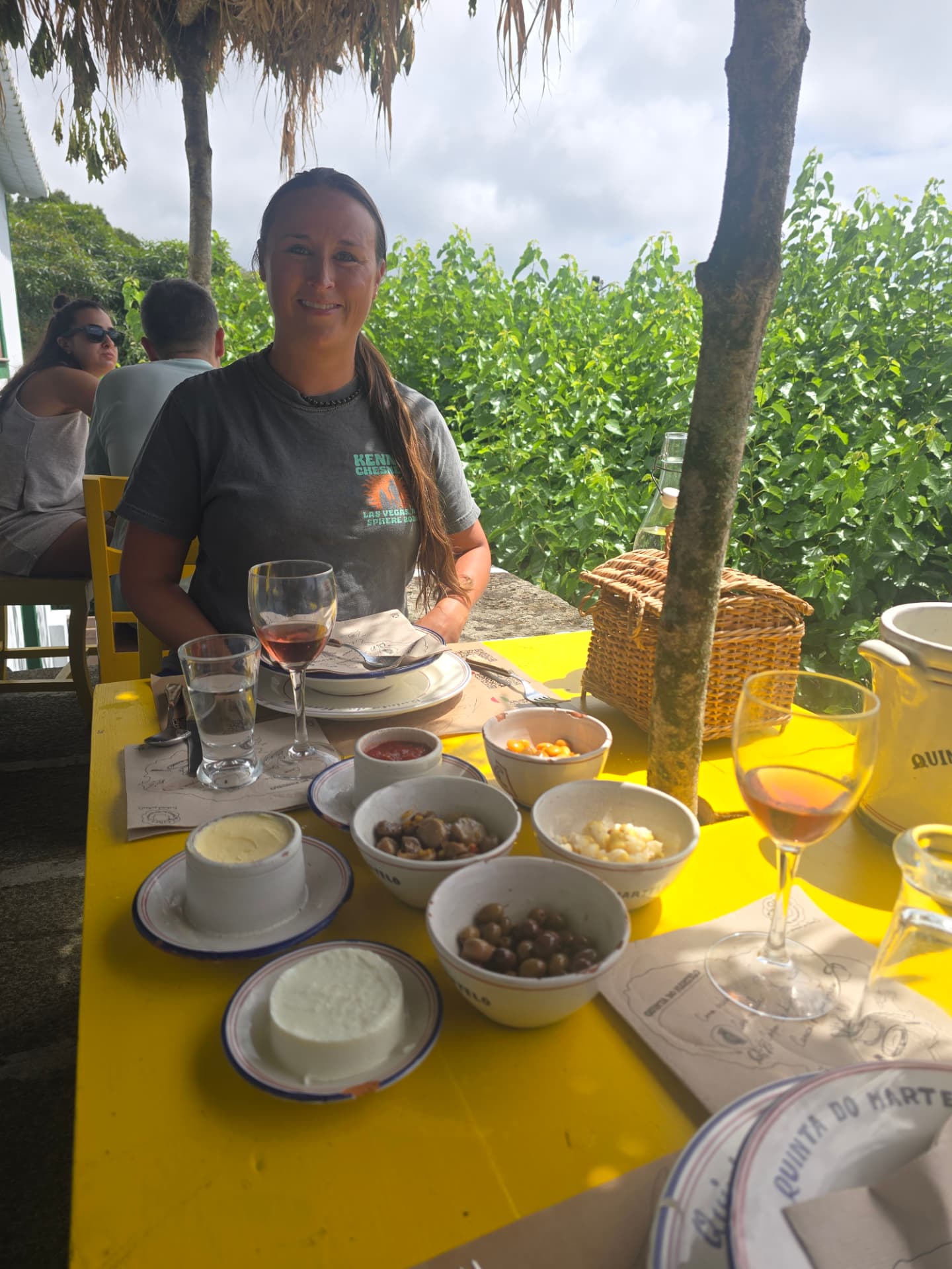 Nikki at a yellow table set with small plates.